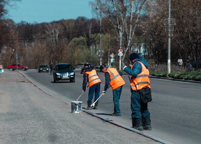 Road Workers Cleaning up the Road
